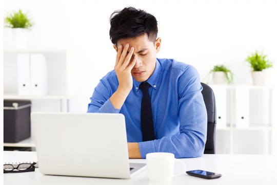 34258202 - stressed business man in the office 34258202 - stressed business man in the office