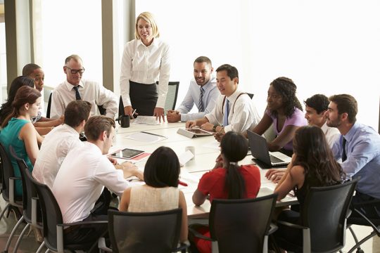 31047674 - businesswoman addressing meeting around boardroom table 31047674 - businesswoman addressing meeting around boardroom table
